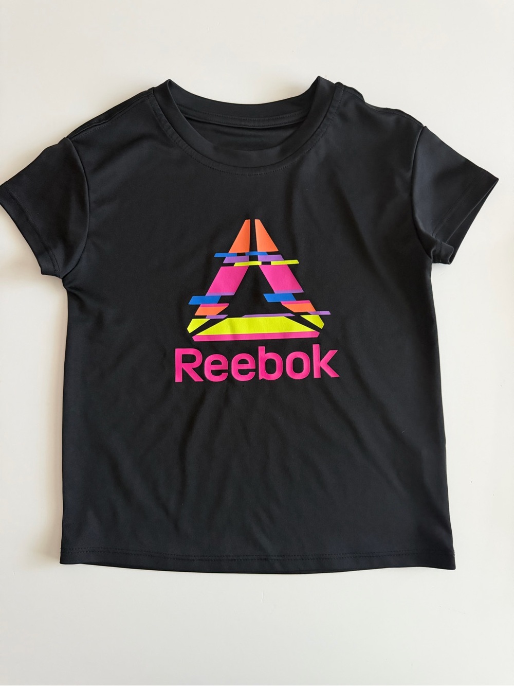 Reebok Girls XS (4/5) Black Tee with Neon Pink Logo and Multicolor Graphic